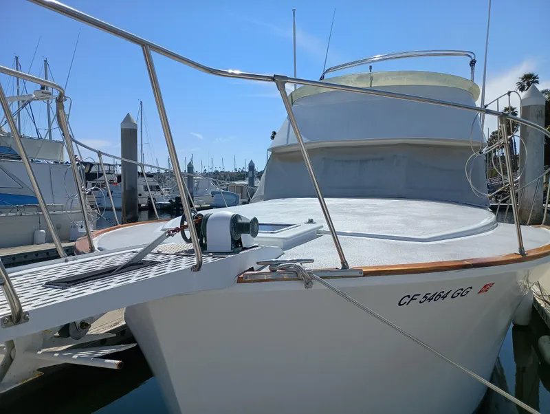 Slide: The Image of 1978 Pacific Bluefin SPF boat docked at marina under clear blue sky. - 47
