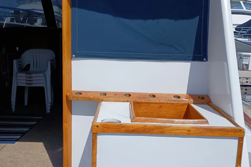 Slide: The Image of 1978 Pacific Bluefin SPF boat interior with wooden trim and seating area. - 6