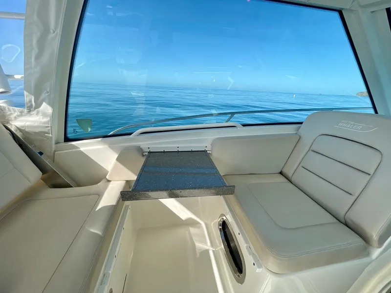 Slide: The Image of Interior view of 2018 Boston Whaler 315 Conquest boat with ocean backdrop. - 16
