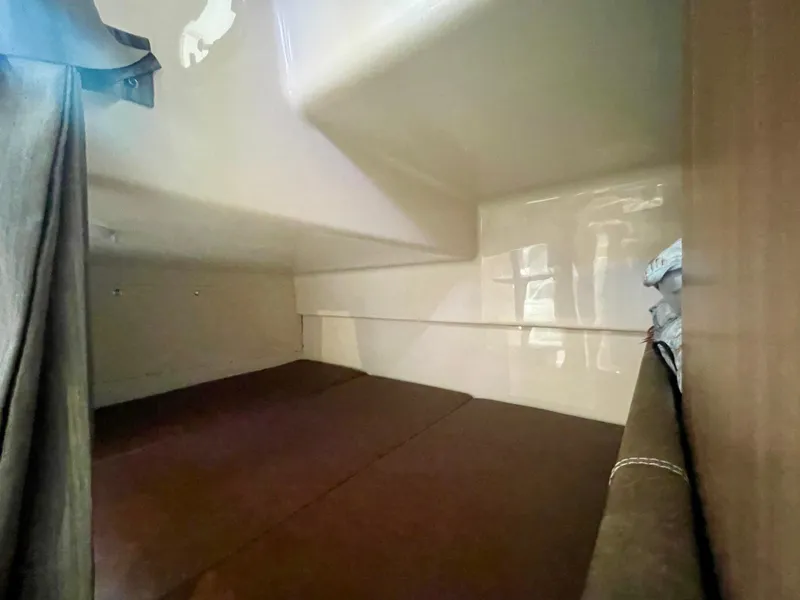 Slide: The Image of Interior cabin of 2018 Boston Whaler 315 Conquest, featuring cozy sleeping area. - 43