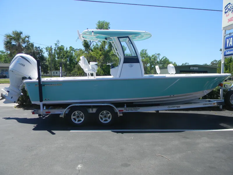 Slide: The Image of 2025 Sportsman Masters 247 Bay Boat on trailer, parked outdoors, side view. - 27