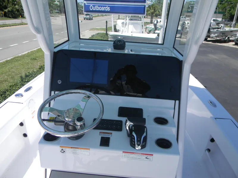 Slide: The Image of 2025 Sportsman Masters 247 Bay Boat console with steering wheel and controls. - 30