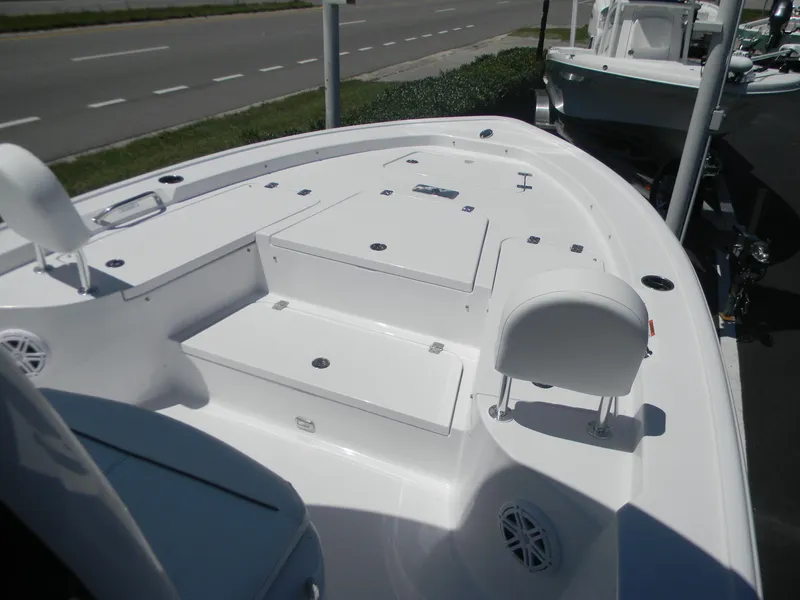Slide: The Image of 2025 Sportsman Masters 247 Bay Boat, spacious deck, white finish, roadside view. - 33