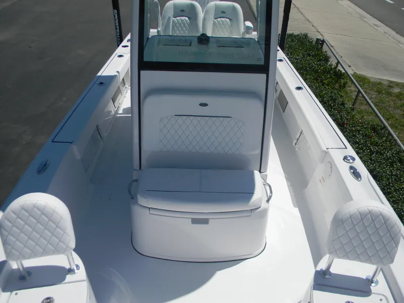 Slide: The Image of 2025 Sportsman Masters 247 Bay Boat interior with white seating and console. - 34
