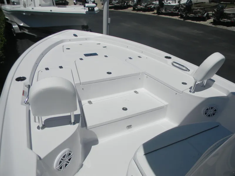 Slide: The Image of 2025 Sportsman Masters 247 Bay Boat deck, featuring spacious seating and storage compartments. - 35