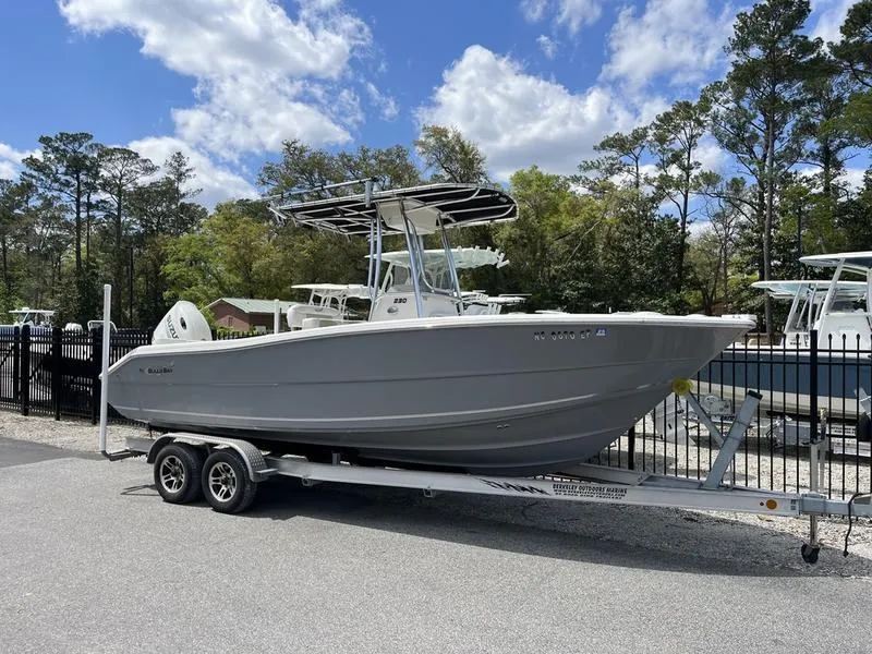 Slide: The Image of 2020 Bulls Bay 230 Center Console boat on trailer, parked outdoors under a blue sky. - 0
