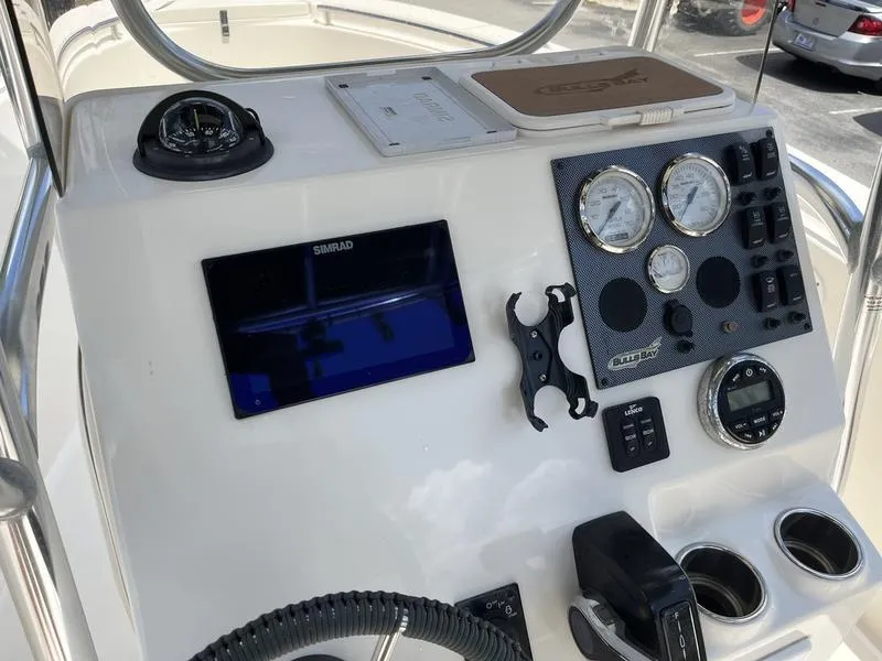 Slide: The Image of 2020 Bulls Bay 230 Center Console dashboard with navigation and control instruments. - 11
