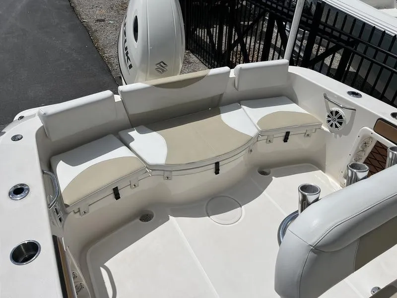Slide: The Image of 2020 Bulls Bay 230 Center Console boat with cushioned seating and cup holders. - 16