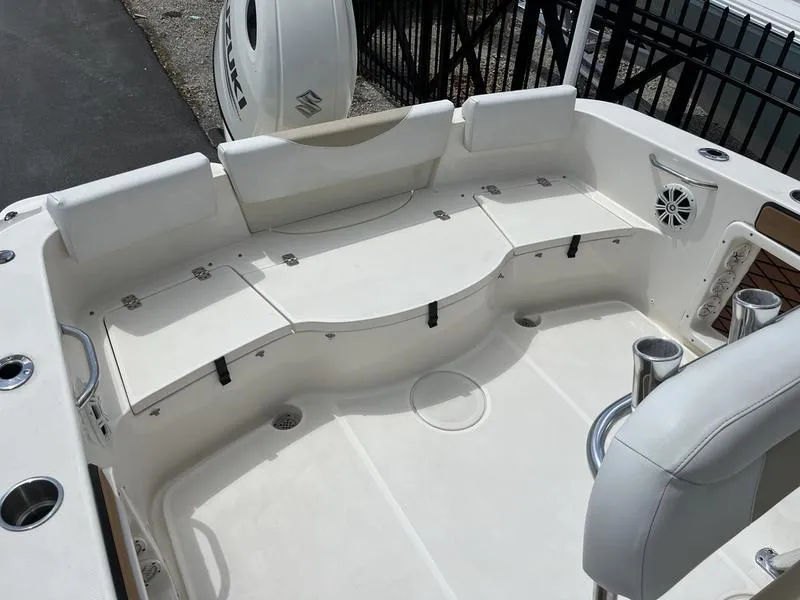 Slide: The Image of 2020 Bulls Bay 230 Center Console boat interior with seating and cup holders. - 17