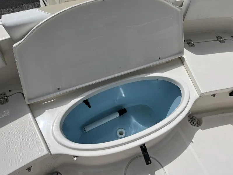 Slide: The Image of Open storage compartment on 2020 Bulls Bay 230 Center Console boat. - 19
