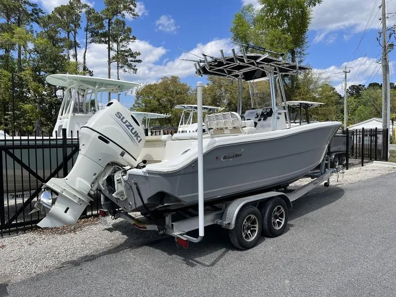 Slide: The Image of 2020 Bulls Bay 230 Center Console boat on trailer with Suzuki outboard motor. - 2