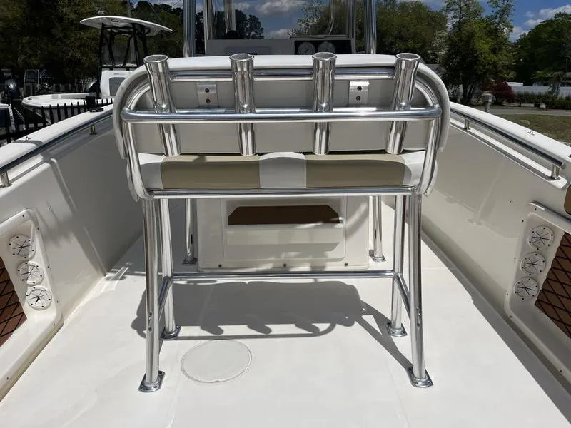 Slide: The Image of 2020 Bulls Bay 230 Center Console boat with rod holders and seating on deck. - 21
