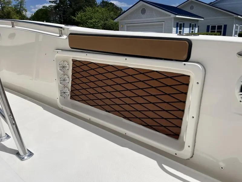 Slide: The Image of 2020 Bulls Bay 230 Center Console boat interior with padded panel and ventilation. - 23