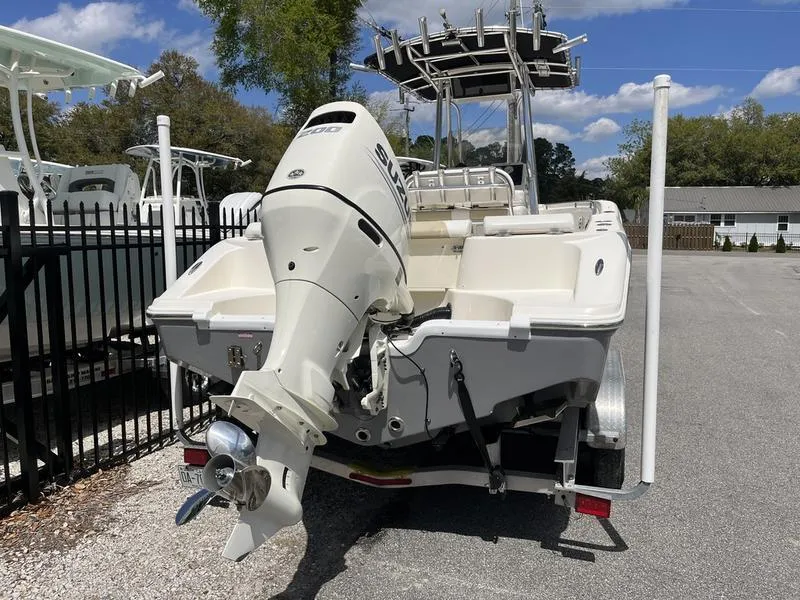 Slide: The Image of 2020 Bulls Bay 230 Center Console boat with outboard motor, parked on a trailer. - 3