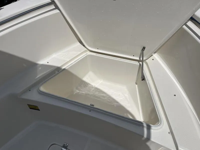 Slide: The Image of 2020 Bulls Bay 230 Center Console boat storage compartment open. - 6