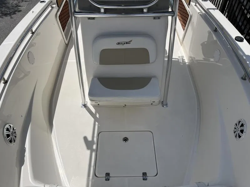 Slide: The Image of 2020 Bulls Bay 230 Center Console boat interior with seating and storage. - 7