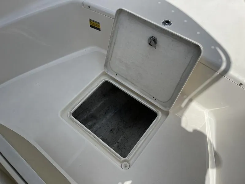 Slide: The Image of Open storage compartment on 2020 Bulls Bay 230 Center Console boat. - 8
