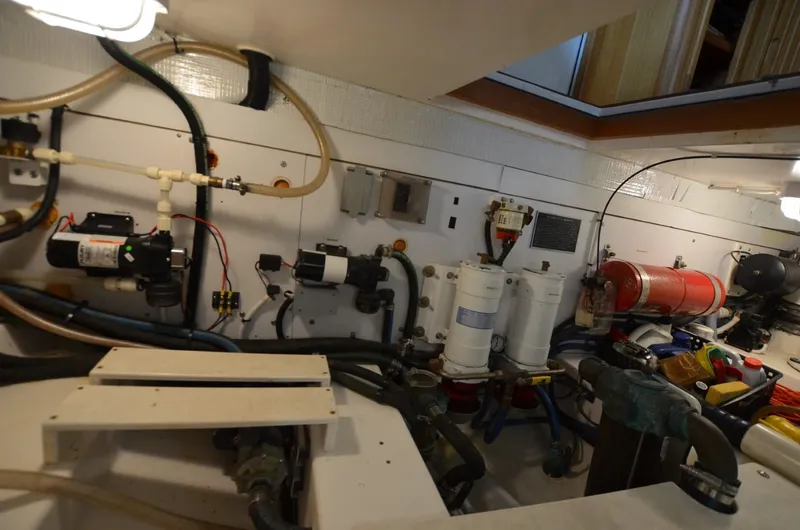 Slide: The Image of Engine room of 2006 Legacy Yachts Sedan, showcasing mechanical components and systems. - 21