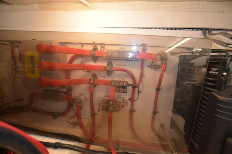 Slide: The Image of Electrical panel with red wiring in a 2006 Legacy Yachts Sedan. - 22