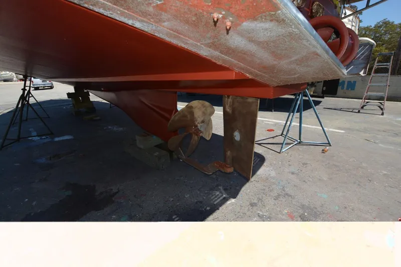 Slide: The Image of 2006 Legacy Yachts Sedan underbody with propeller and rudder in dry dock. - 24