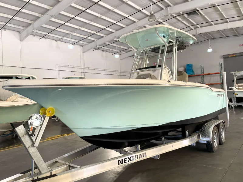 Slide: The Image of 2024 Key West 239 FS boat on trailer in indoor showroom. - 1