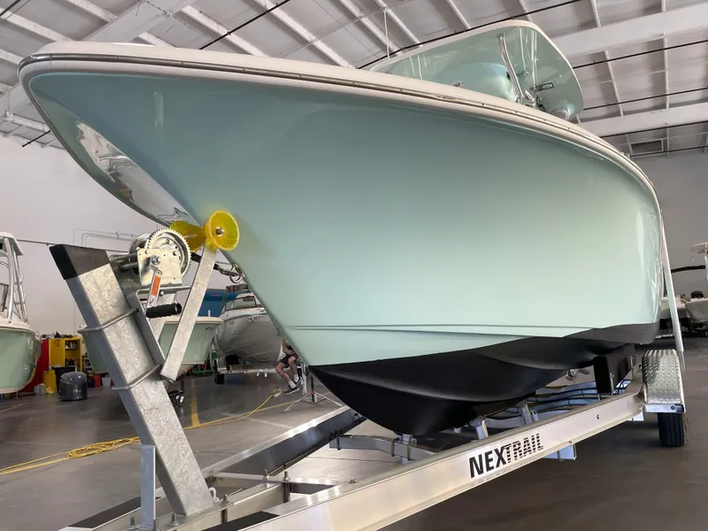 Slide: The Image of 2024 Key West 239 FS boat on trailer in indoor storage facility. - 10
