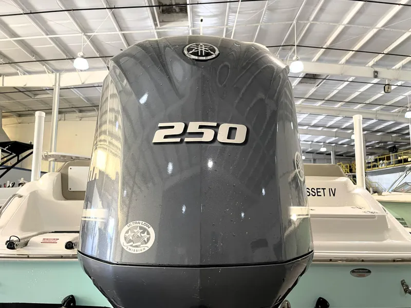 Slide: The Image of 2024 Key West 239 FS boat with a 250 horsepower engine in a showroom. - 17