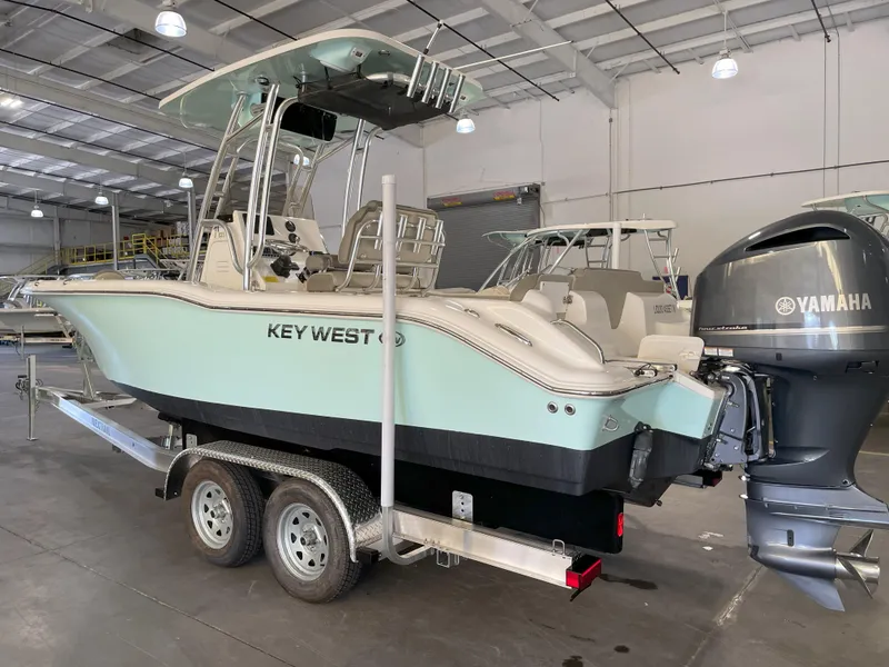 Slide: The Image of 2024 Key West 239 FS boat with Yamaha engine on trailer in warehouse. - 2
