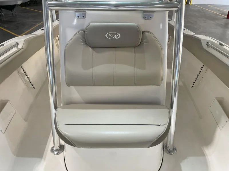 Slide: The Image of 2024 Key West 239 FS boat interior with cushioned seating and stainless steel frame. - 25