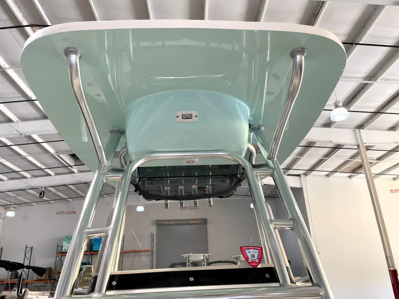 Slide: The Image of 2024 Key West 239 FS boat T-top structure in a showroom. - 26