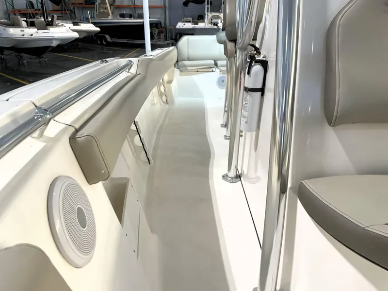 Slide: The Image of 2024 Key West 239 FS boat interior with seating and safety equipment. - 27