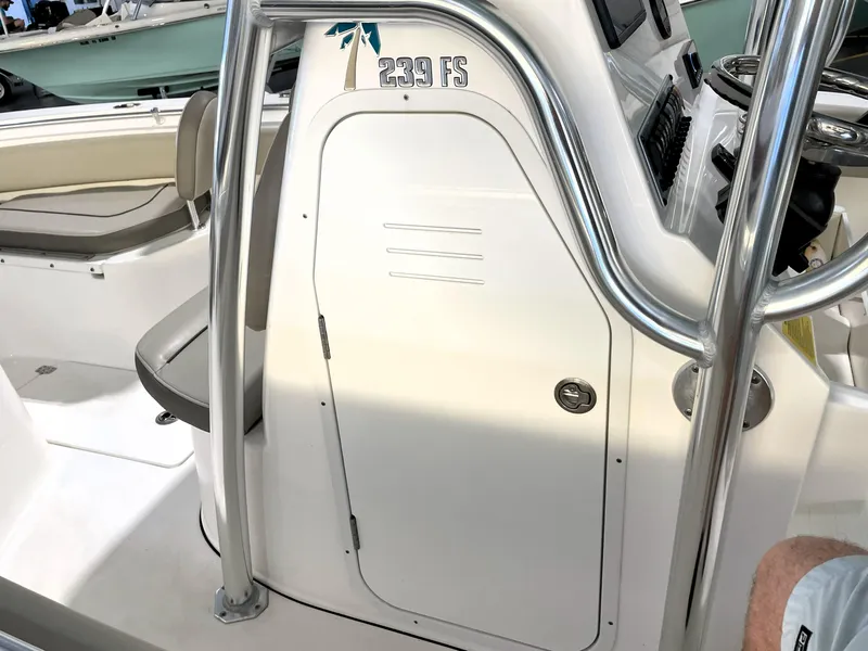Slide: The Image of 2024 Key West 239 FS boat interior with seating and console details. - 29