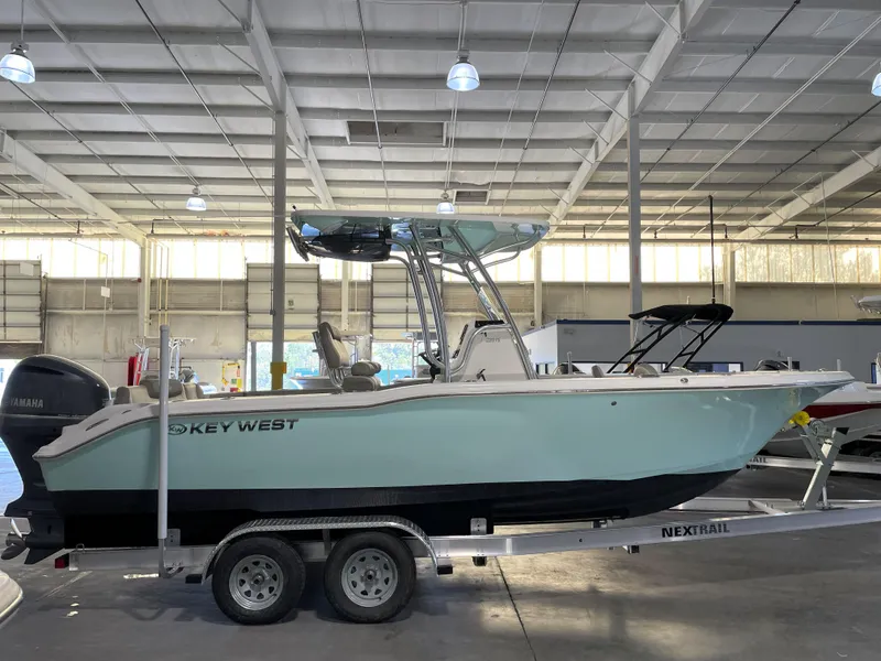 Slide: The Image of 2024 Key West 239 FS boat on trailer in indoor storage facility. - 3