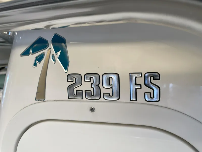 Slide: The Image of 2024 Key West 239 FS boat logo with palm tree design. - 30