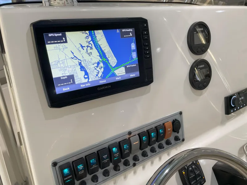 Slide: The Image of 2024 Key West 239 FS boat dashboard with Garmin GPS and control panel. - 35