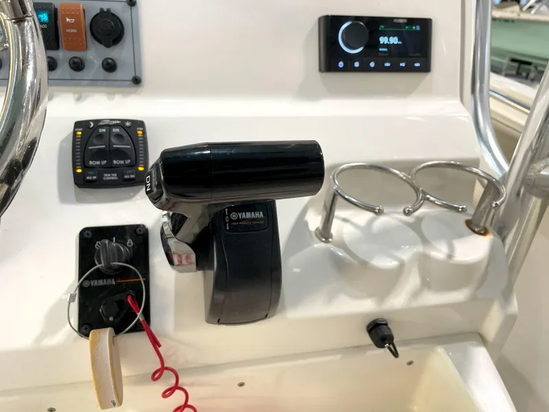Slide: The Image of 2024 Key West 239 FS boat dashboard with Yamaha controls and modern electronics. - 37