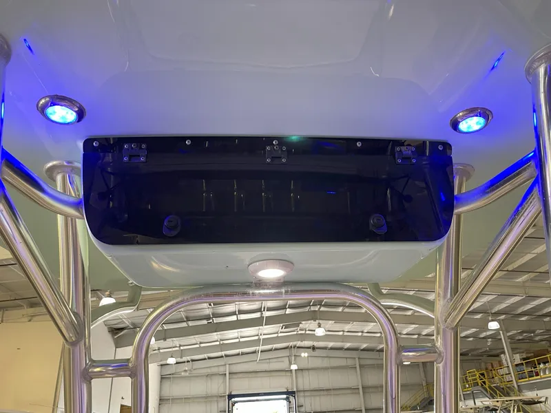 Slide: The Image of 2024 Key West 239 FS boat interior with blue LED lights and stainless steel framework. - 45