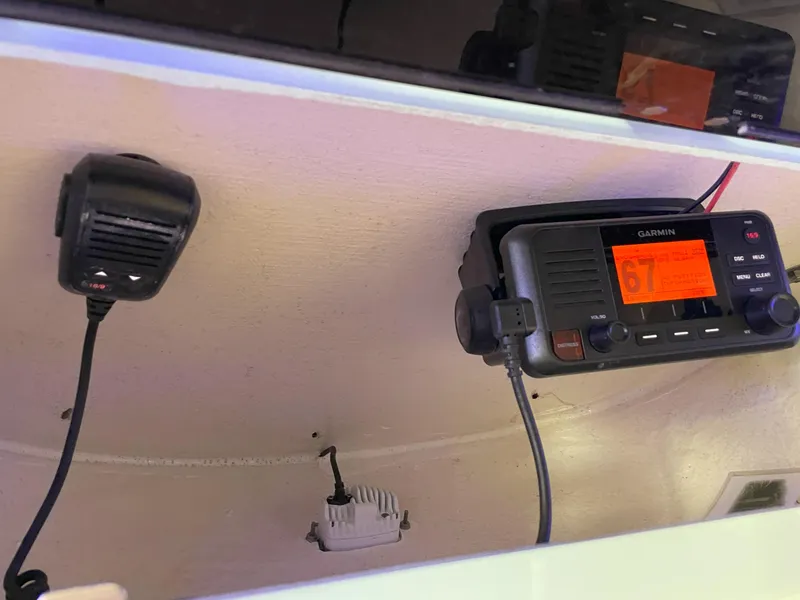 Slide: The Image of 2024 Key West 239 FS boat radio and microphone setup. - 46