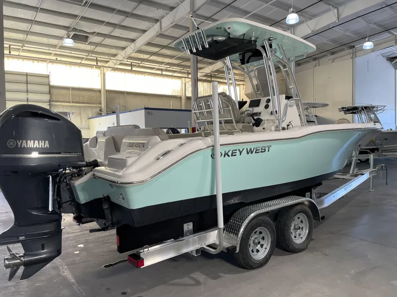 Slide: The Image of 2024 Key West 239 FS boat with Yamaha engine on trailer in warehouse. - 5