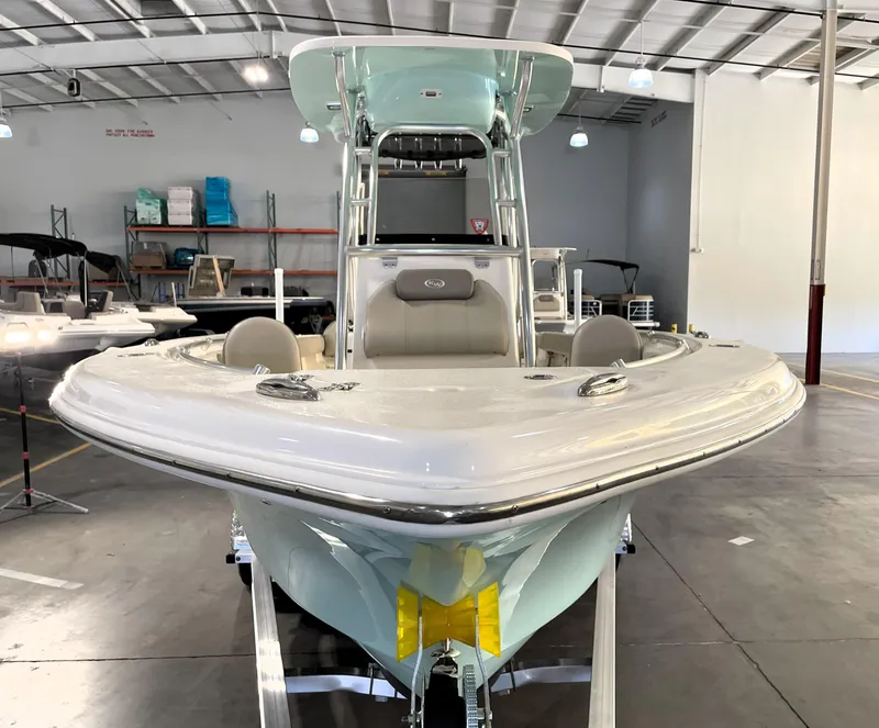 Slide: The Image of 2024 Key West 239 FS boat in showroom, front view, sleek design, modern features. - 6