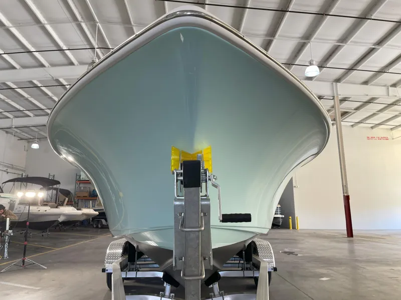 Slide: The Image of 2024 Key West 239 FS boat on trailer in indoor storage facility. - 8