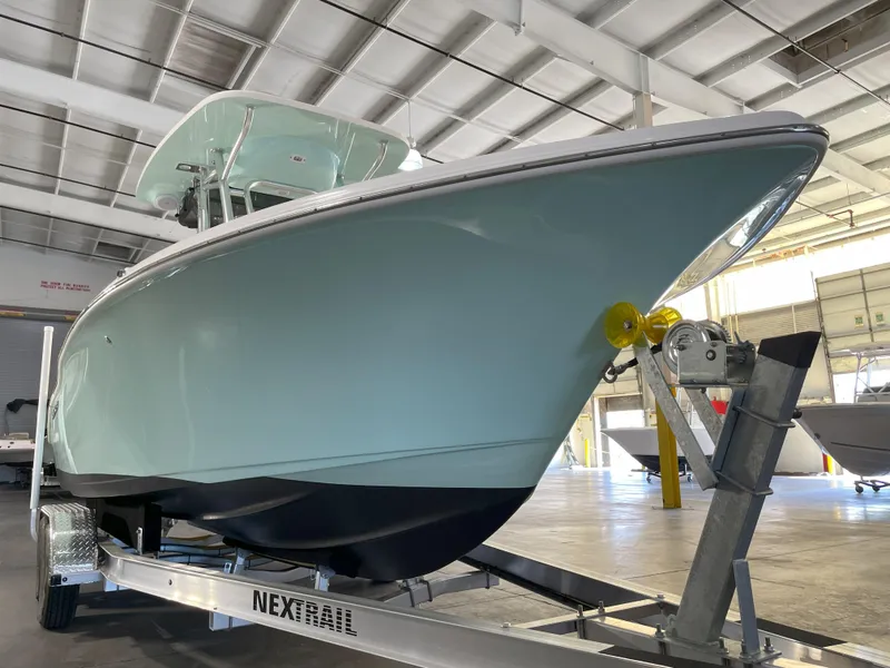Slide: The Image of 2024 Key West 239 FS boat on trailer in indoor storage facility. - 9