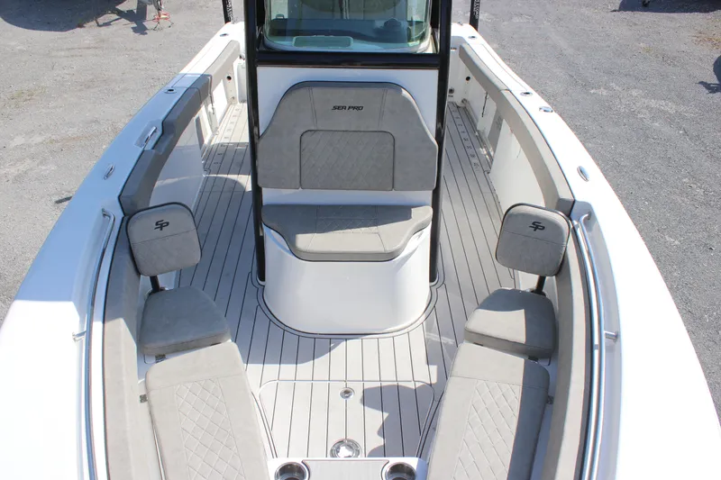 Slide: The Image of 2023 Sea Pro 239 Deep V CC boat interior with cushioned seating and sleek design. - 10