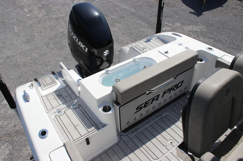 Slide: The Image of 2023 Sea Pro 239 Deep V CC boat with Suzuki outboard motor, rear deck view. - 4