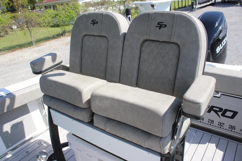 Slide: The Image of 2023 Sea Pro 239 Deep V CC boat seats with armrests and diamond-pattern upholstery. - 5