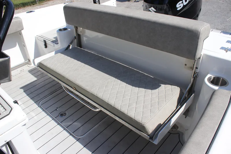 Slide: The Image of 2023 Sea Pro 239 Deep V CC boat with cushioned bench seat and cup holders. - 6