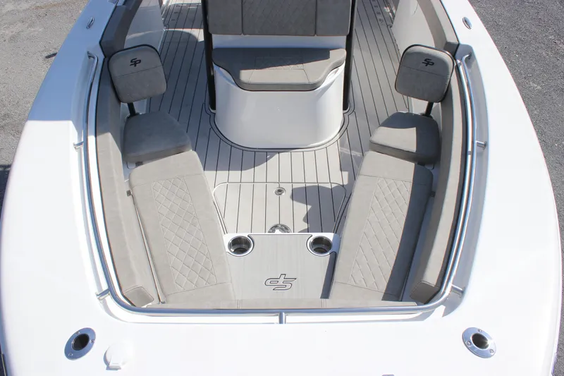 Slide: The Image of 2023 Sea Pro 239 Deep V CC boat interior with cushioned seating and sleek design. - 9