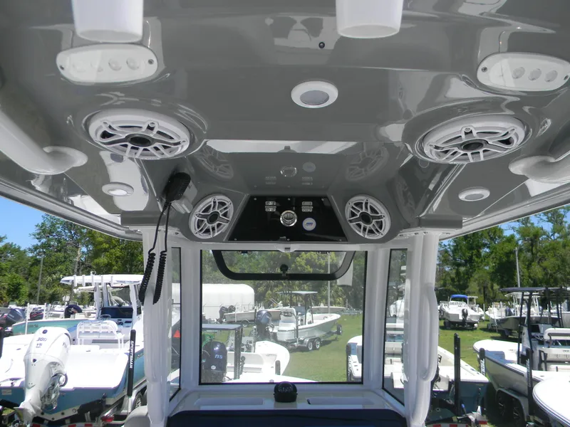 Slide: The Image of 2025 Sportsman Masters 267 Bay Boat interior with speakers and control panel. - 11