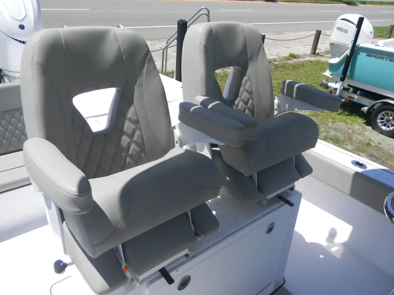 Slide: The Image of 2025 Sportsman Masters 267 Bay Boat with dual cushioned seats and armrests. - 7