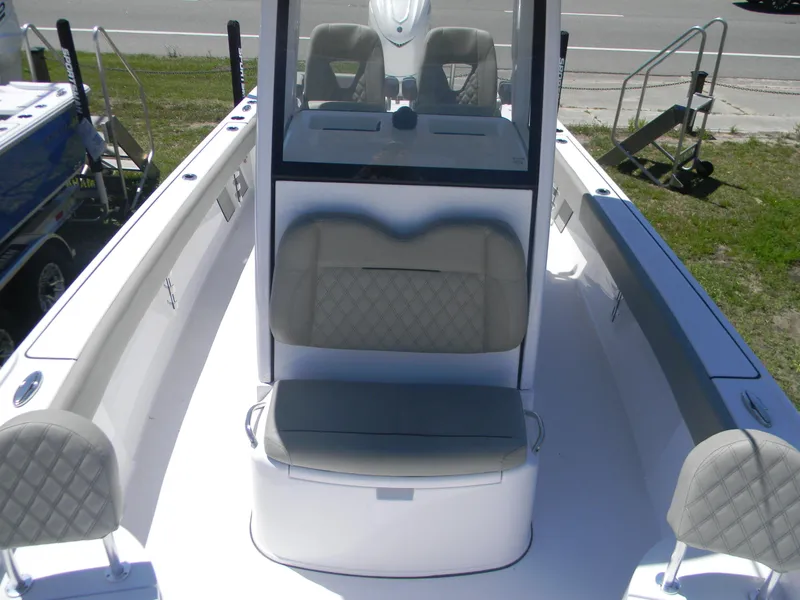 Slide: The Image of 2025 Sportsman Masters 267 Bay Boat interior with cushioned seating and console. - 9